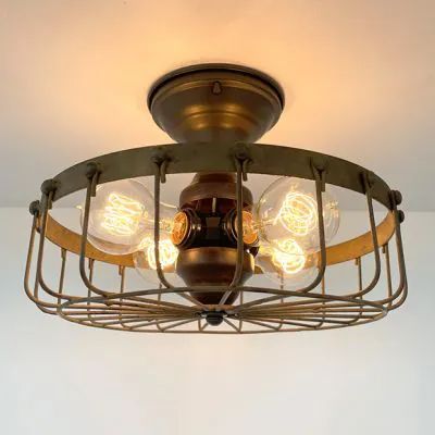 A FIRESIDE GLOW | Shop Sales Events Antique Farmhouse Cage Light Fixture, Cage Ceiling Light, Edison Bulb Lamp, Farmhouse Industrial, Industrial Ceiling Lights, Cage Light, Industrial Ceiling, Cabin Lighting, Farmhouse Chandelier