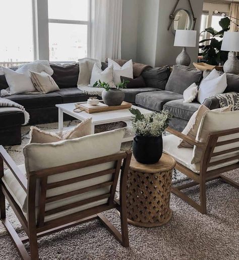 Round wooden lattice end table is perched between beige accent chairs with stained wood frames. The chairs face a square white living room coffee table placed in front of a grey sectional. White Living Room Table, Gray Sectional Living Room, Gray Sectional, Grey Couch Living Room, Black And White Living Room, Beige Living Rooms, Grey Sectional, Modern Farmhouse Living Room, White Living