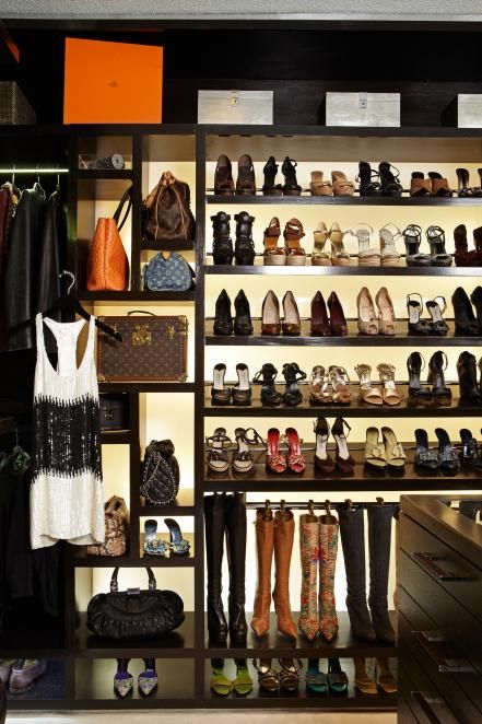 A custom shelving unit is the stand-out feature in this walk-in closet. Stocked with bags and shoes, the backlit shelves show off the sartorial goods while making each item easier to find. Dream Closet Design, Luxury Closets Design, Closet Decor, Dream Closets, Custom Storage, Walk In Wardrobe, Dream Apartment, Master Closet, Closet Designs