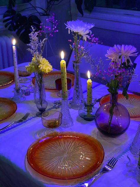 Table with candles orange and yellow plates flowers and candles with a purple hue over the photo table was set up for a birthday dinner Maximalist Dinner Party, Aesthetic Birthday Party, Dinner Birthday Party, Birthday Party Dinner, Aesthetic Dinner, Flowers And Candles, Brat Summer, Aesthetic Birthday, Candle Images