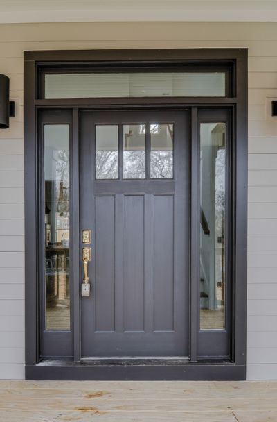 31 Houses With Black Front Entry Door Ideas - | Sebring Design Build Craftsman Exterior Door, Craftsman Front Door, Exterior Doors With Sidelights, Front Door With Sidelights, Black Exterior Doors, Door With Sidelights, Craftsman Front Doors, Entry Door With Sidelights, Exterior Door Designs