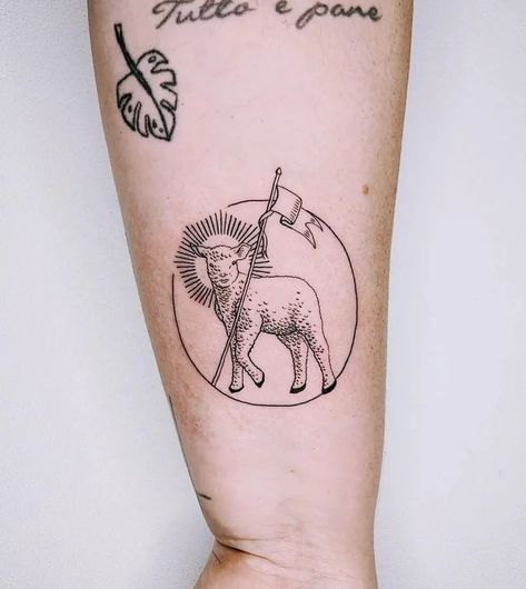 What Does a Lamb Tattoo Mean? Symbolism, Art Ideas - Parade Paschal Lamb Tattoo, Lamb Lion Tattoo, Lamb Face Tattoo, Lion Of Judah Lamb Of God Tattoo, Shepherds Staff Tattoo, Lamb With Crown Of Thorns Tattoo, Worthy Is The Lamb Tattoo, Lamb Head Tattoo, American Traditional Lamb Tattoo