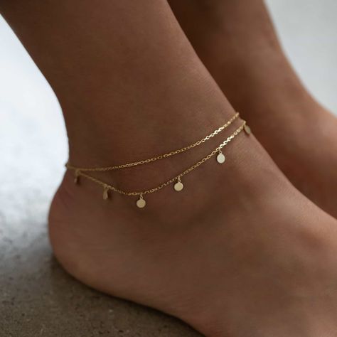 Dress up plain pumps or flats with this chic anklet featuring dangling polished discs on a layered chain. Thick layer of 14K Gold over .925 Sterling Silver 4mm Discs Hypoallergenic, lead, and nickel free Length: 9in (22cm) + Extension: 1in (2.5cm) Lobster clasp closure Handcrafted in NYC #ANK014 Flat Gold Bangles, Ankle Bracelets Aesthetic, Ankle Bracelets Gold Anklet, Gold Delicate Anklets For Summer, Gold Anklet Aesthetic, Casual Gold Minimalist Anklets, Anklet Aesthetic, Anklets Aesthetic, Aesthetic Anklets