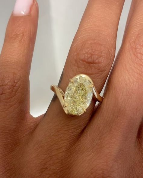 AARYAH on Instagram: "One of the most unique engagement rings we’ve ever made with a fancy yellow oval cut✨ ~ When we posted the video of this stunning bespoke ring, our DMs were flooded. This ring is truly one-of-a-kind, featuring a rare fancy yellow oval cut diamond with the most exquisite lemon hue. We had the honor of working with a wonderful couple who came to us with their unique vision for an engagement ring. They had a clear idea of what they wanted, and we were excited to bring their dream to life. Our journey began with an initial concept that included a bezel setting for the diamond. However, the couple wanted to ensure the body of the diamond had its own moment to shine. Over the course of three weeks, we collaborated closely, refining the design to perfectly encapsulate their Lime Green Engagement Ring, Yellow And White Diamond Ring, Yellow Oval Engagement Ring, Unique Setting Engagement Ring, Aaryah Ring, One Of A Kind Engagement Rings, Oval Engagement Ring Unique, Engagement Rings Aesthetic, Radiant Bezel