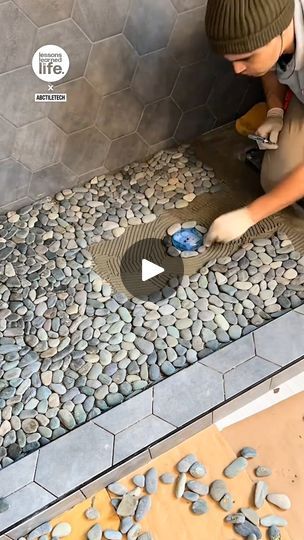 Laying pebbles for a shower 🚿 | These pebbles transform the shower and make the flooring slip-proof! 🚿🤩 | By Lessons Learned In LifeFacebook Outdoor Shower With Pebble Floor, Master Shower Pebble Floor, Stone Bottom Shower Pebble Floor, Resin Shower Floor, Bathroom With Pebbles, Tiled Shower Floor Ideas, Shower Floor Tile Ideas Pebble Stone, Cobblestone Shower Floor, Diy Shower Floor Ideas