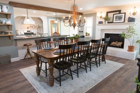 Clint built this table for the Beachums to gather around for holidays together. It turned out perfectly for this space, and the family loved it. Farmhouse Dining Room With Fireplace, Dining Room With Fireplace Layout, Joanna Gaines Dining Room, Beam Ideas, Fireplace Dining Room, Fixer Upper Dining Room, Dining Room With Fireplace, Joanna Gaines Decor, Dining Room Table And Chairs