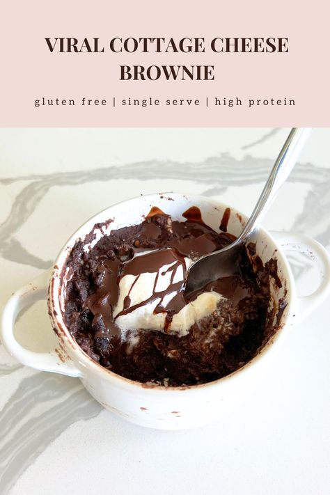 This healthy single-serve cottage cheese brownie is gluten free, keto, low sugar, and high protein. It's an easy healthy dessert. In a small white dish there is a rich dark chocolate brownie with a lava cake, gooey, fudgey texture. Chocolate chunks lay on top that have melted into the brownie. A white dollop of whipped cream and chocolate drizzle is on top of everything. A spoonful of the brownie is shown to show the soft gooey texture and melting chocolate. Cottage Cheese Reese’s Lava Brownie, Protein Rich Desserts Low Carb, Protein Brownie Mug Cake, Cottage Cheese Lava Brownie, Chocolate Cottage Cheese Dessert, Low Cal Desserts For One, Healthy Ramekin Dessert, High Protein Cottage Cheese Brownies, Cottage Cheese Lava Cake Microwave