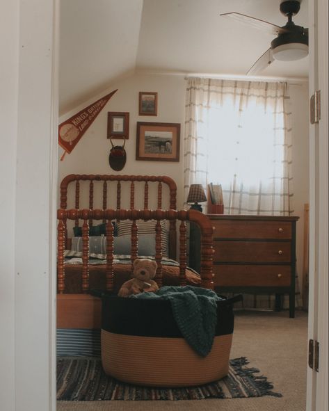 Vintage style little boys room with a rag rug, green dresser, vintage art, and plaid curtains Vintage Farm Bedroom, Modern Vintage Boys Room, Board And Button With Wallpaper, Antique Kids Room, Farmhouse Toddler Boy Room, Cottagecore Boys Room, Vintage Boys Room Decor, Antique Boys Room, Vintage Americana Nursery