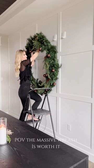 Jordyn Smith on Instagram: "POV you hang the massive wreath from your basement and it's so worth it! Comment SHOP for links to this space. I've been staring at this wreath now for a couple weeks wondering if it will make an appearance from the basement storage room. And then it clicked where it needed to go... How to shop me home/ Click link in my BIO or comment SHOP for links to similar large wreaths! Wreath Holiday decor Dining room Go big Holiday season Home decor" Large Wreath Outdoor Christmas Decor, Large Window Wreath Christmas, Diy Big Wreath, Large Wreath Over Fireplace, Hanging Wreath On Door, Large Outdoor Wreath On House, Wreath Display Ideas, Diy Giant Wreath, Large Wreath Outdoor