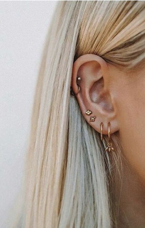 Is your constellation of trendy ear piercings having an unwanted effect on your mind-body balance? We asked an acupuncture pro to break it down... Ušný Piercing, Orca Tattoo, Ear Peircings, Ear Piercings Chart, Piercing Chart, Hamsa Tattoo, Pretty Ear Piercings, Piercing Tragus, Piercing Cartilage