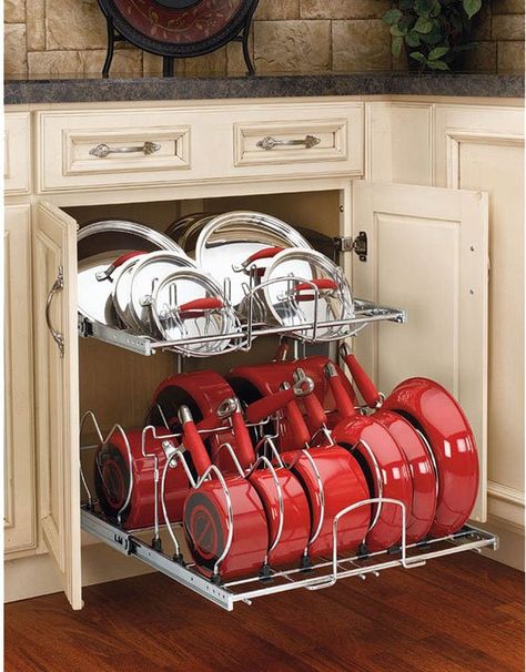 Organized kitchen storage cabinets! This is a really easy, great way to store store pots, pans, and lids. This pot rack has a place for every piece and it’s easy to put things back where they belong! One of the best kitchen cabinet organizers I've seen. #kitchen #storage #cabinets #organizers #pots #pans Organiser Cucina, Cookware Organization, Pot And Pans Organization, Pan Storage, Farmhouse Kitchen Cabinets, Diy Kitchen Storage, Kitchen Cabinets Makeover, New Kitchen Cabinets, Cabinet Makeover