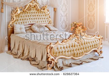 Luxury bedroom in light colors with golden furniture details. Big comfortable double royal bed in elegant classic interior Golden Bed, Luxury Bedroom Lighting, Beautiful Bed Designs, Wooden King Size Bed, Bedroom Ideas Luxury, Golden Furniture, Royal Bed, Design Ložnic, Luxury Bedroom Furniture