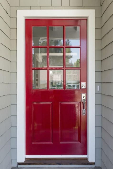 A very simple and contemporary front door with light gray siding and brushed nickel fixtures. The top half of the door is adorned by nine glass panels. Gray Siding, Front Door With Screen, Exterior Door Hardware, Grey Siding, Red Front Door, Contemporary Front Doors, Front Door Entryway, Black Front Doors, Modern Front Door