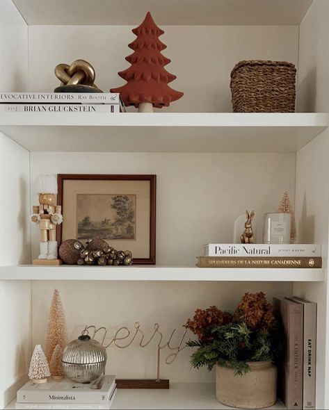 Boho Christmas Shelf Decor, Built In Shelf Christmas Decor, Shelf Styling Christmas, Living Room Shelves Christmas Decor, Christmas Decor On Shelf, Modern Christmas Bookshelf Decor, Holiday Shelf Decor Living Room, Open Shelf Christmas Decor, Christmas Floating Shelf Decor