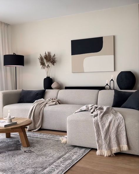 living room wall decor ideas Minimal Black And White Living Room, Beige L Couch Living Room Ideas, Grey Beige Black And White Living Room, Beige Couch Apartment, Cream And Black Lounge, Black And Beige Room Aesthetic, Neutral And Black Home Decor, Cream And Black Decor, Black Grey Beige Living Room