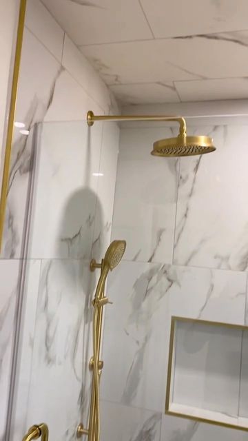 Vogt • Kitchen & Bath Fixtures on Instagram: "Dripping in Gold. Bathroom remodel by @newellsquality Featured Collection: Zehn Featured Finish: Brushed Gold #Vogt #Bathroom #BathroomRenovation #Bathroom #Shower #ShowerDesign #ShowerRenovation" White Gray Gold Bathroom, Gold Bathroom Shower Fixtures, Shower With Gold Accents, Gold Restroom Decor Ideas, Brushed Gold Shower Fixtures, Cream And Gold Bathroom Ideas, Bathroom Gold Fixtures, Brushed Gold Bathroom Fixtures, Gold Shower Fixtures