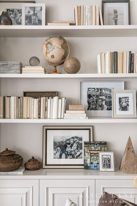 Love this shelf styling! How to style books, photographs, picture frames, and objects on shelves or bookshelves. Lovely neutral colour scheme. PARCELL HOME — ALICE LANE INTERIOR DESIGN Acrylic Shelf Styling, Tv Shelf Decorating Ideas, Shelf Styling With Books, Bookcase Decorating, Styling Bookcases, Shelves Styling, Styled Shelves, Bookshelf Inspo, Shelf Decorating