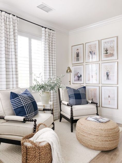 A pair of lounge chairs in traditional spool-turned frame, with fresh-looking upholstery and trim. Photo wall gallery using multiple frames, neatly arranged in a grid. Wicker basket and ottoman plus the blue and white scheme add to the relaxed vibe. Casual, yet gives some sense of formality. #neotraditional #interiordesign Furnitur Ruang Keluarga, Bedroom Master, Cool Ideas, Decor Minimalist, A Living Room, Formal Living Rooms, Front Room, Bedroom Inspo, Lounge Chairs