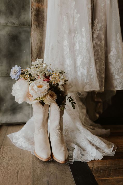 Country Wedding Dress Boots, Wedding In Cowboy Boots, Wedding Dress With Country Boots, Cowgirl Styled Shoot, Writing On Boots For Wedding, Brides With Cowboy Hats, Cowgirl Boots Bride, Brides Boots Wedding, Cowboy Boot Bride