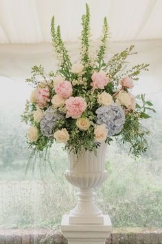 Floral urns are perfect for creating that romantic feel for a wedding ceremony. Beautiful Family Homes, Vintage Flower Arrangements, Church Wedding Flowers, Vintage Wedding Table, Altar Arrangement, Table Arrangements Wedding, Tall Wedding Centerpieces, Large Flower Arrangements, Church Flower Arrangements