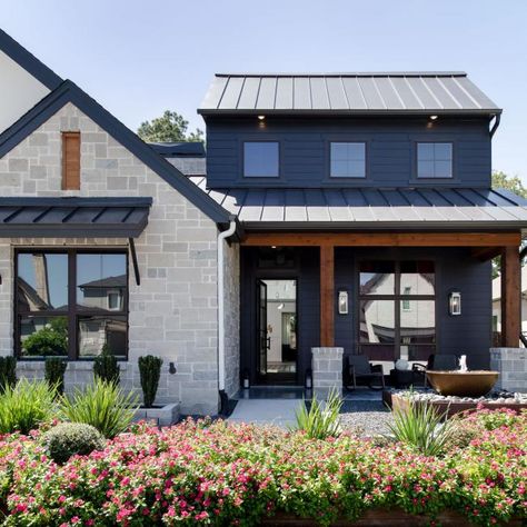 Black House Exterior With Lush Landscaping | HGTV Gray Exterior House Colors, Moody Exterior, Black Siding, Grey Exterior House Colors, Modern Exteriors, Black Metal Roof, Moody Modern, Black Cabin, Exterior House Color