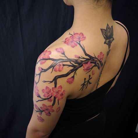 101 Best Cherry Blossom Tree Tattoo Ideas You'll Have To See To Believe! - Outsons Shoulder Clavical Tattoos For Women, Cherry Blossom Tattoo Arm Half Sleeves, Back Of The Shoulder Tattoos For Women, Tree Tattoo On Arm, Cherry Blossom Tattoo Shoulder, Japanese Cherry Blossom Tattoo, Cherry Tree Tattoos, Tree Tattoo Ideas, Cherry Blossom Tree Tattoo