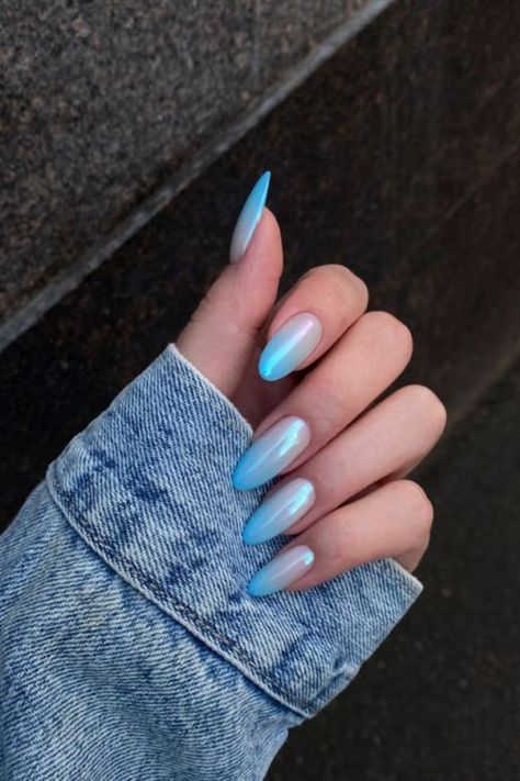 Blue nails may not be the first option that comes to mind when you think about manicures, but it’s undeniably beautiful, especially once pulled off. So here are some gorgeous blue manicure ideas to try the next time you get your nails done. Blue Gel X Nails Almond, Light Colour Nails, Nude Blue Nails, Blue Nail Ombre, Blue Crome Nails Almond, Blue Ombre Nails Almond, Ombre Nails Almond Blue, Blue Acrylic Nails Almond, Baby Blue Nails Ideas