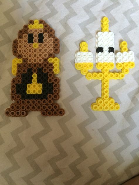 Lumiere and cogsworth, the lamp and the clock, from Disney's beauty and the beast perler beads Beauty And The Beast Perler, Lumiere And Cogsworth, Hama Beads Disney, Hama Disney, Perler Bead Designs, Melt Beads Patterns, Modele Pixel Art, Hamma Beads Ideas, Easy Perler Bead Patterns