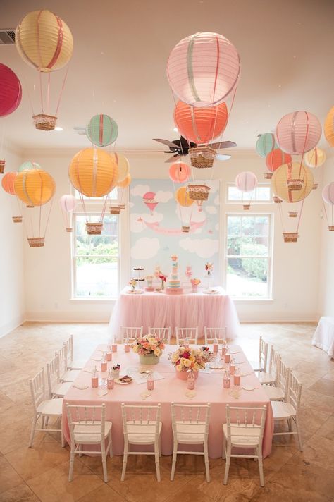 Create one stunning eye-catching display by hanging paper lantern hot air balloons from the ceiling. This is a great idea for an “Up In The Air” baby shower or birthday party! | Photo: Alefiya Akbarally via Kara’s Party Ideas Hot Air Balloon Party, Babyshower Party, Hot Air Balloon Decorations, Ballon Party, Travel Party Theme, Baby Shower Balloons, Baby Party, Paper Lanterns, Baby Birthday