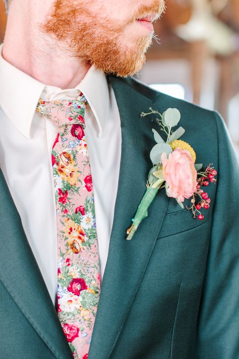 Jack decided to ditch the classic black tie and opt for one that was covered in the flowers that were a part of the rest of their wedding. Follow our social media for more of Katie and Jack's dreamy wildflower wedding! IG: @maurajanesphoto | Website: maurajanephotography.com Colorful Wedding Outfit Men, Groom Floral Shirt, Groom Attire Garden Wedding, Colorful Wedding Suits Men, Men’s Wedding Looks, Wildflower Wedding Suit, Wildflower Wedding Groom Suit, Floral Groom Suit, Wildflower Groomsmen