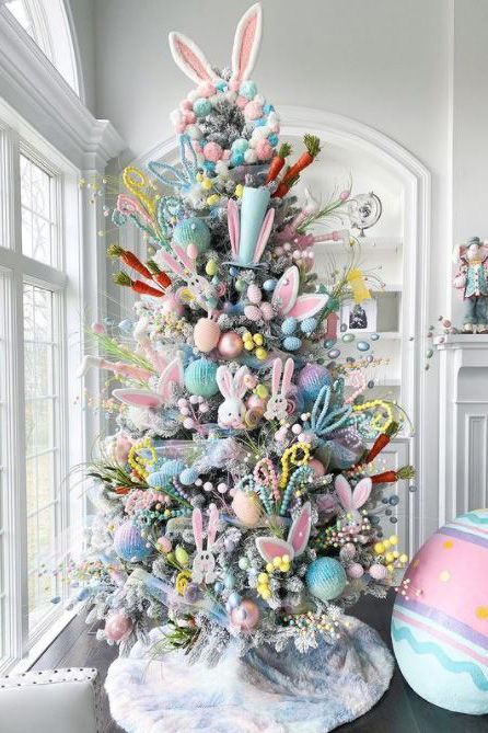 This Easter tree is an explosion of color. Dress up a flocked artificial tree for spring by tucking faux egg branches and pastel beads into the boughs. Add a few stuffed bunnies, pastel ornaments, and paper carrots for a colorful mix. #eastertree #eastertreeideas #easterdecorations #bhg Easter Christmas Tree, Branches Vase, Easter Tree Diy, Diy Tree Decor, Easter Tree Ornaments, Easter Egg Tree, Easter Craft Decorations, Easter Tree Decorations, Spring Decoration