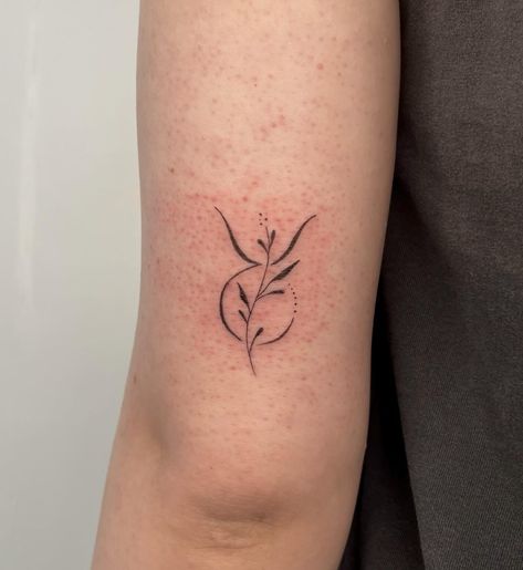 Taurus zodiac symbol tattoo on the outer arm Dainty Taurus Tattoo For Women, Taurus Wildflower Tattoo, Taurus Tattoo Elements, Taurus Birth Flower Tattoo, Daisy Taurus Tattoo, Fine Line Tattoo Taurus, Taurus Sun Tattoo, Simple Taurus Tattoo For Women, Taurus Floral Tattoo