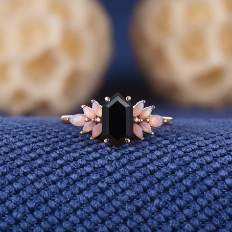 Unique Long Hexagon Cut Black Onyx Engagement Ring Rose Gold Opal Cluster Wedding Ring Dainty Black Gemstone Rings Anniversary Gift For Her Jewelry Information: ♡ Handmade, high-quality item ♡ Material: SOLID 14K/18K GOLD ( can be made in yellow/white/rose gold ) ♡ Center stone: black onyx ♡ Size/Weight:  5x9mm ♡ Cut - Long Hexagon Cut ♡ Side stone: Natural opal ♡ Cut - Marquise Shaped ♡ Band Width: Around 1.8mm Visit my shop for more jewelry: https://www.etsy.com/shop/acraisejewelry PRODUCTION Opal And Onyx Engagement Ring, Unique Gemstone Rings, No Diamond Engagement Ring, Alt Wedding Rings, Dark Wedding Ring, Rose Gold Rings Engagement, Dark Engagement Ring, Gothic Engagement Rings, Non Traditional Wedding Rings