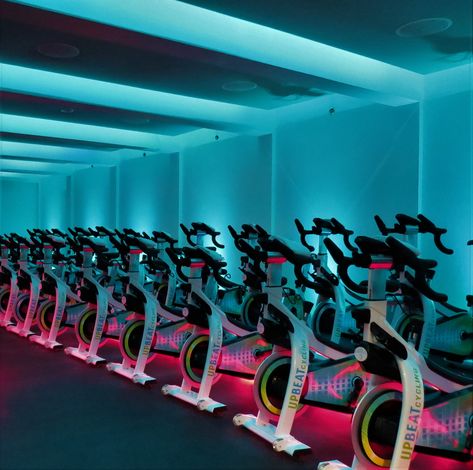 Cycling studio design experts Spin Studio Design Ideas, Cycling Studio Design, Bike Room Design, Flywheel Design, Spinning Studio, Indoor Cycling Studio, Cycle Studio, Warehouse Gym, Small Home Gym Ideas