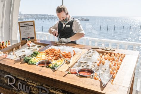 What could possibly make this scene more picturesque?! Our fresh Raw Bar consists of clams, crab claw lollipops, Shrimp, and most importantly - Freshly Shucked Oysters. Beautiful Bay scenes may or may not be included. #michaelseventcatering #catering #outdoorwedding #tentwedding #cheflife #serverlife #photooftheday #love Oyster Shucking Table, Raw Bar Wedding, Oyster Bar Wedding, Oyster Display, Ceviche Bar, Wedding Food Bars, Wedding Food Display, Seafood Bar, Seafood Buffet