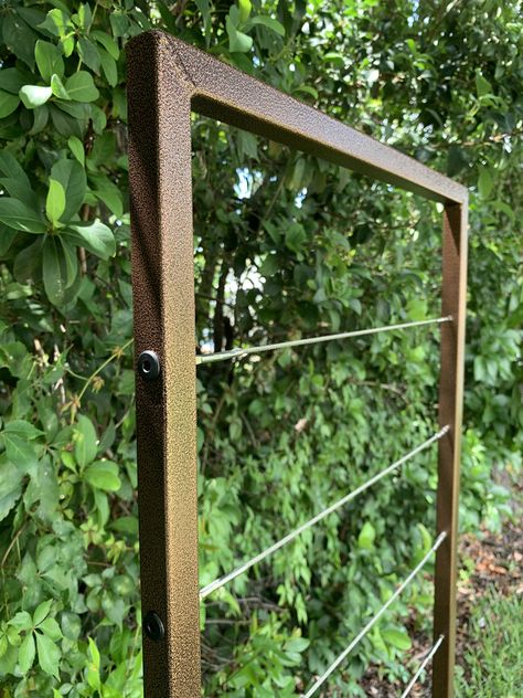 Excited to share this item from my #etsy shop: Clean and Modern Trellis, Metal Frame, Stainless Steel Wire, Wall Mount or Staked, Aluminum Frame, Garden, Lightweight, Handmade, 60" x 22" Trellis Metal, Wall Mounted Trellis, Modern Trellis Design, Decorative Trellis, Metal Garden Trellis, Wire Trellis, Wall Trellis, Modern Trellis, Trellis Fence