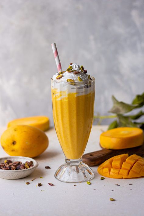 Who doesn’t like the ultimate seasonal mango milkshake? If you’re saying no to this question in your head, you have to go to your kitchen and make this mango milkshake. Trust me, you’ll never say no to one again! Mangoes are finally in season and I think we all wait for this time very eagerly because mangoes are so versatile! You can do anything you want with them, like making this milkshake. Summer Milkshakes, Fruit Milkshake, Valentines Party Food, Mango Milkshake, Ice Cream Shake, Mango Ice Cream, Chocolate Shake, Chocolate Milkshake, Milkshake Recipes