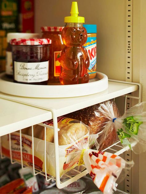 A lazy Susan makes it easy to find condiments that otherwise get pushed to the back of the pantry. More simple storage solutions: http://www.bhg.com/decorating/storage/organization-basics/simple-storage-for-less/?socsrc=bhgpin060213lazysusan=3 Organize Pantry, Diy Pantry Organization, Easy Hacks, Diy Pantry, Bread Storage, Kitchen Organization Pantry, Diy Kitchen Storage, Kitchen Cabinet Organization, Diy Kitchen Cabinets