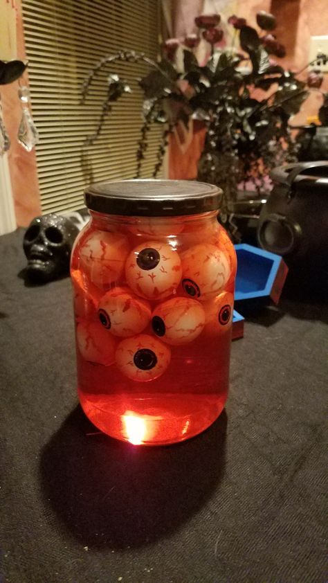 Creepy Things In Jars, Oddities Halloween Decor, Eyeballs Halloween Decorations, Halloween Head In A Jar Diy, Eye Ball Halloween Decorations, Eyeballs In A Jar Halloween, Halloween Eyeballs In A Jar, Eyeball Decorations Halloween, Halloween Test Tube Decor