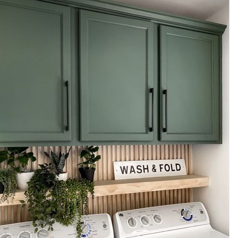 Green Accent Wall Laundry Room, Laundry Room Inspiration Modern, Wood Backsplash Laundry Room, Laundry Room Sage Green Cabinets, Laundry Room Makeover With Window, Green And Brown Laundry Room, Laundry Closet With Cabinets, Laundry Space In Kitchen, Laundry Room Colored Cabinets