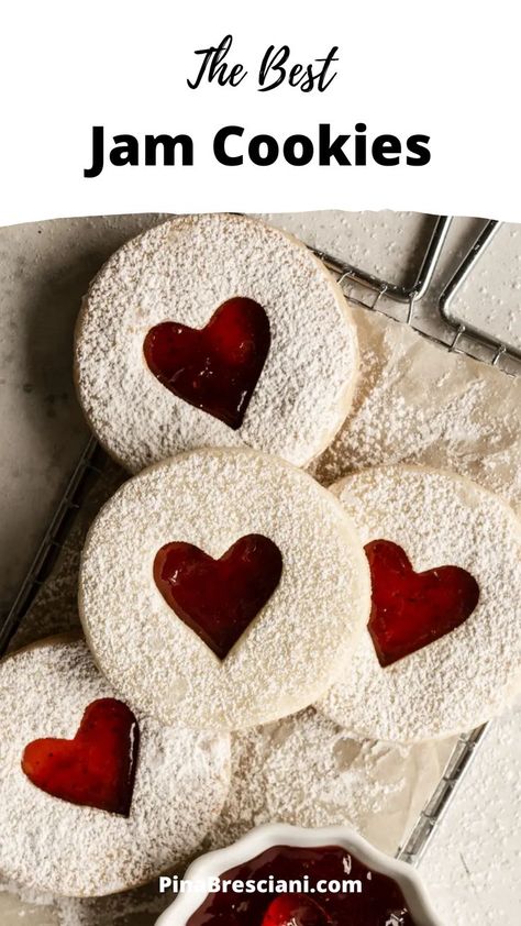 These strawberry jam cookies are made of a delectable shortbread dough, where delicious strawberry jam is sandwiched between two cookies. They store really well – so you can make them in advance, and serve them when the time is right! Also, how cute is the heart cutout? Strawberry Jam Cookies, Heart Cookies Recipe, Easy Jam, Linzer Cookies, Jam Cookies, Valentine Cookies, Christmas Pudding, Homemade Cookies, Jam Recipes