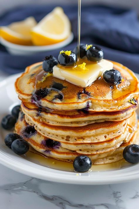 These lemon blueberry pancakes are light, fluffy, and irresistible! Treat your family to a fancy breakfast they'll jump out of bed for. Pancakes With Toppings, Lemon Blueberry Pancakes Recipe, Fancy Breakfast Recipes, Winter Breakfast Recipes, Fancy Pancakes, Extra Fluffy Pancakes, Blueberry Food, Breakfast Classic, Lemon Blueberry Pancakes