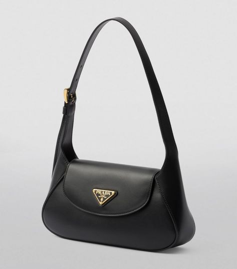 A refined example of timeless leatherwork, this shoulder bag by Prada merges a sleek silhouette with supple leather. Topped with the House’s Triangle motif and offering a choice between being carried by hand or worn over the shoulder, this piece is an evergreen creation with distinctive day-to-night versatility. Prada Black Bag, Black Prada Bag, Luxury Bags Collection, Designer Shoulder Bag, Prada Shoulder Bag, Vintage Shoulder Bag, Jewelry Accessories Ideas, Girly Accessories, Pretty Bags