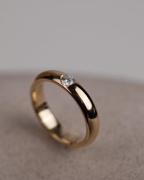 Get inspired with our sleek and stunning Ellipse Diamond Ring – the epitome of modern elegance. Crafted with 18K recycled solid gold and featuring a radiant 0.1ct lab-grown diamond, this ring exudes timeless charm that will last for life. Its rounded and polished surface adds a touch of refinement to any ensemble, whether worn solo for a statement look or stacked for added allure. #diamondring #diamondjewelry #statementpiece #labgrowndiamond Simple Stone Ring Design, Gold Engagement Ring Designs, Simple Stone Ring, Simple Ring Design, Modern Gold Ring, Gold Ring Design, Gold Ring Simple, Drive Poster, Stone Ring Design