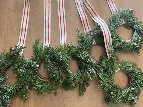 How to Hang a Wreath With Ribbon on Cupboard - The Idea Room Wreaths On French Doors Inside, Hanging Christmas Wreath, Hanging Wreaths With Ribbon, Ribbon To Hang Wreath, Wreaths With Ribbons Hanging, Hanging A Wreath With Ribbon, Diy Cabinet Wreath, Wreath With Ribbon Hanging, How To Add Ribbon To A Wreath