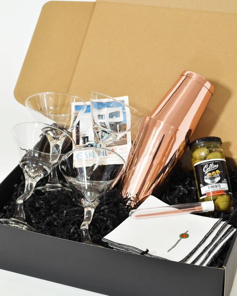 It's always martini time with this gift set! Includes everything to elevate your spirits in one box. Comes with the best Collin's pimento stuffed olives, rose gold accoutrements from Bull in China, and the adorable napkins from Dot and Army. Cheers to good times ahead 🍸🫒🎉 Shop our other gift boxes online! Martini Gift Basket Ideas, Martini Gift Basket, Dirty Martini, Serving Table, Gold Cocktail, Gift Of Time, Bar Drinks, Good Time, Box Set