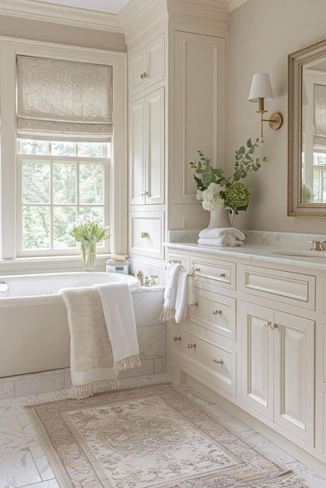 Cream And Marble Bathroom, White Bathroom Beige Tile, Elegant White Bathroom Ideas, Cream Cabinet Bathroom, First Floor Bathroom Ideas, Best Bathroom Countertops, Light Neutral Bathroom, Neutral Marble Bathroom, Cream Cabinets Bathroom