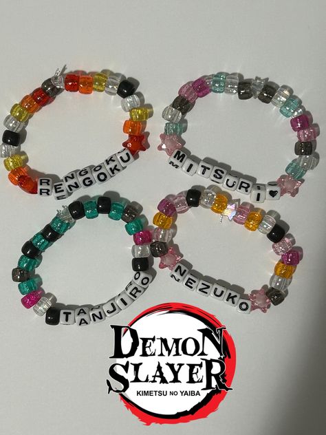 Bracelets I made based off of the characters from Demon Slayer! These bracelets are well made, containing 27-28 beads, are colorful, and are stretchy so they can fit everyone! Demon Slayer Bracelet Ideas, Bracelets Kits, Naruto Bracelet, Mha Bracelet Ideas, Demon Slayer Friendship Bracelet, Therian Bracelet Ideas, Bracelet Ideas Characters, Character Kandi Bracelets, Kandi Bracelets Matching