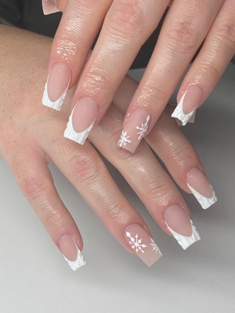 It can be anything, as long as it's holiday-themed! Winter Christmas Nails French Tip, White French Tips Christmas Nails, French Tips Nails Christmas, Short Winter French Tip Nails, French Tip Nails With Design Winter, Short White Christmas Acrylic Nails, French Tip Nails Christmas Simple, Short Acrylic Nails For Christmas, White Christmas Nails French Tips