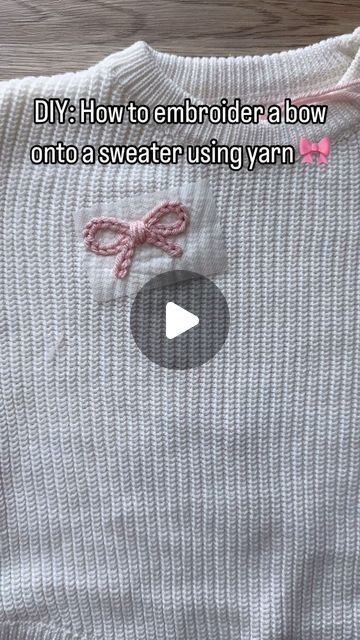 Aspen Lyn Outlet | Hand-Embroidery on Instagram: "How to embroider a bow onto a knit sweater using yarn.  Yarn is a weight 4 from yarn bee!  . . . . #diyembroidery #sulky #embroiderykit #beginnerembroidery #embroiderytutorial #embroidery #handembroidery #yarnembroidery #mamaandme #personalizedbabyclothes #babyshower #babyshowergift #newbornoutfit #announcementoutfit #newbabyannouncement #babynamesweater #customsweater #namesweater #embroideredsweater #coloradomoms #hospitalbag #firstbirthday#coloradosmallbusiness #womanownedbusiness #kidsclothing #embroiderydiy #genderneutral #embroiderytutorial #chainstitch" Simple Sweater Embroidery, Knit Embroidery Sweater Name, Yarn Chain Stitch, Christmas Sweater Embroidery Pattern, Chain Stiching Ideas, Embroidery Designs On Sweaters, Embroidery With Yarn Letters, Chunky Yarn Embroidery, Embroidery On Knitting Tutorials